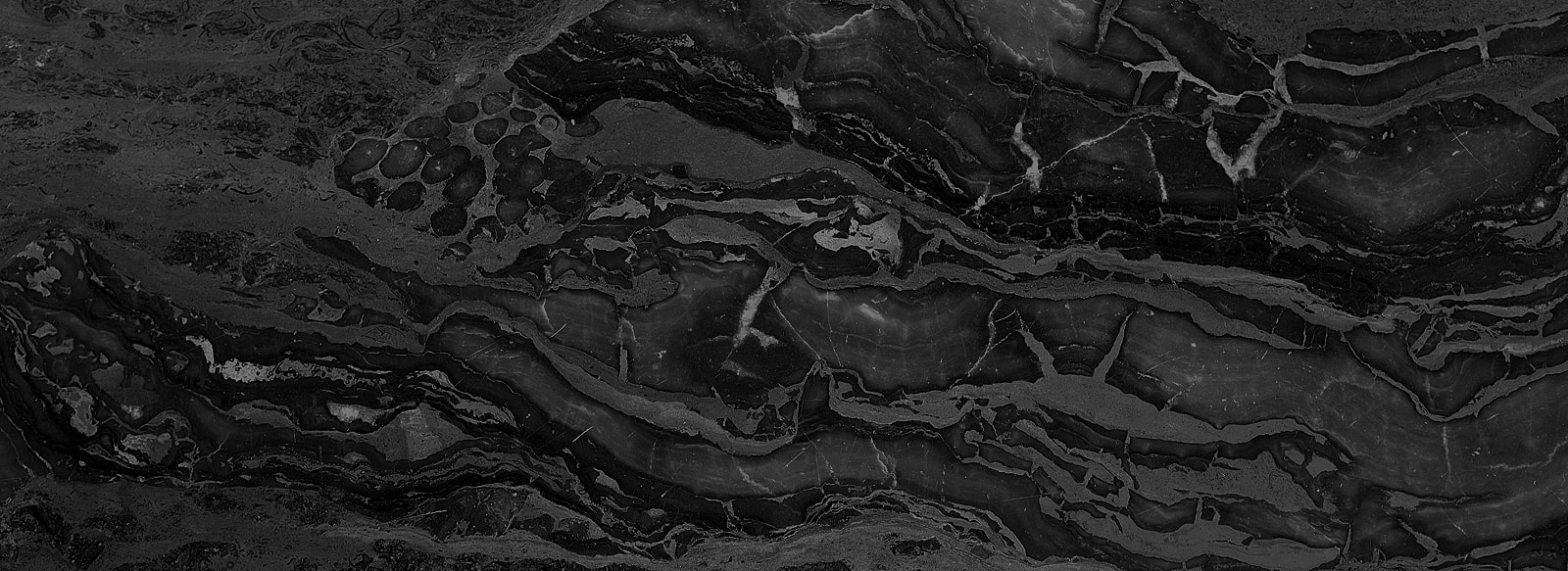 Black marble with white veining patterns.