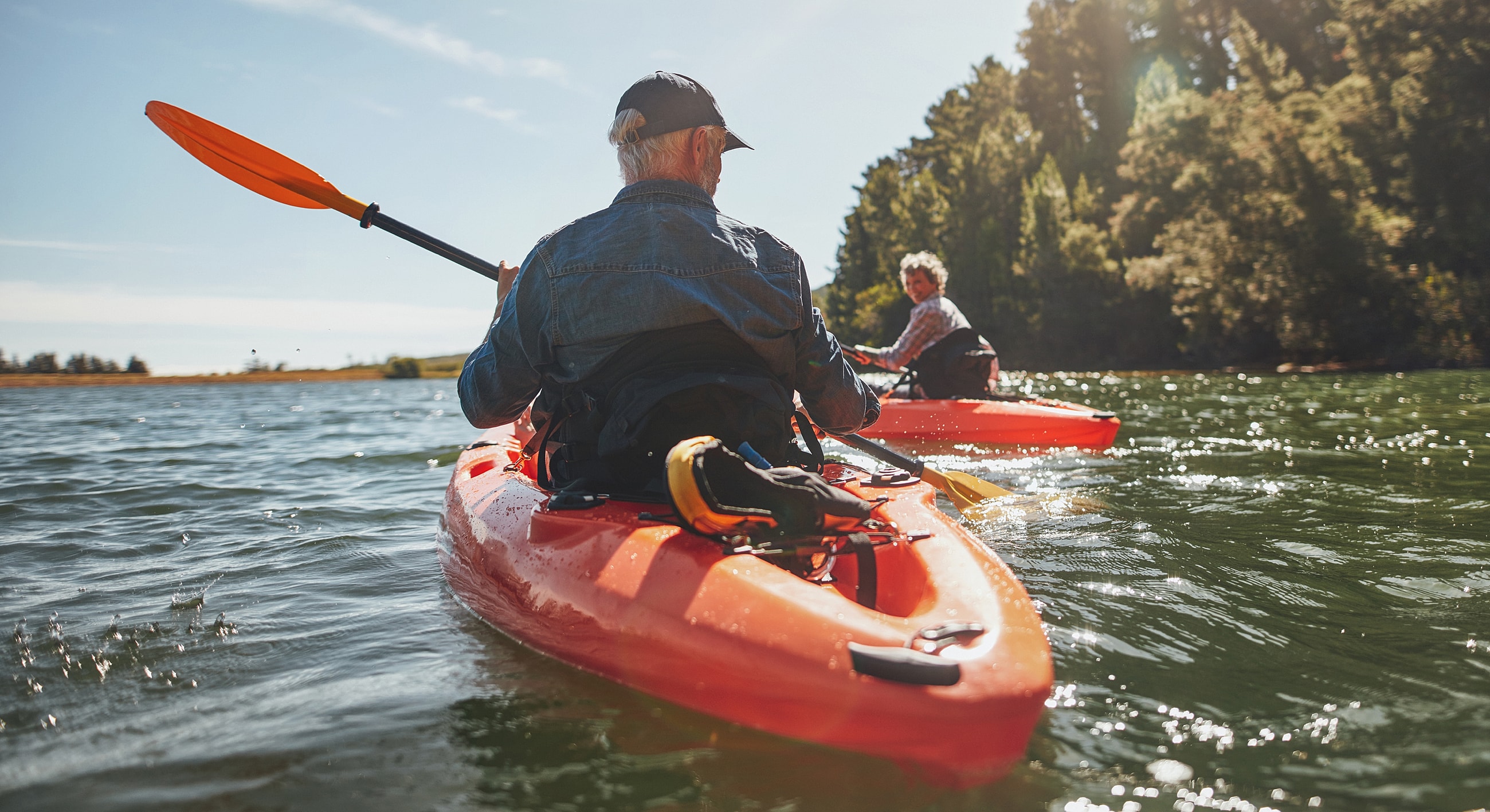 Kayakers enjoying a sunny day on the water.